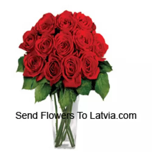 15 Red Roses With Some Ferns In A Glass Vase