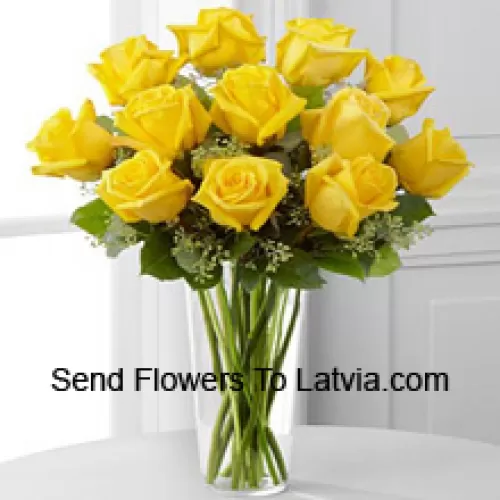 11 Yellow Roses With Some Ferns In A Glass Vase