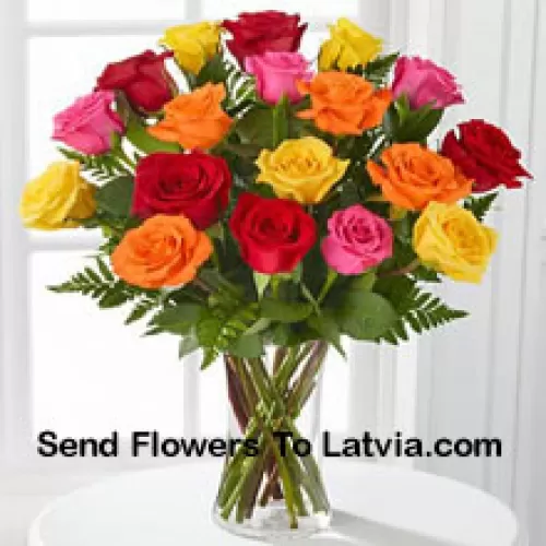 19 Mixed Colored Roses With Seasonal Fillers In A Glass Vase