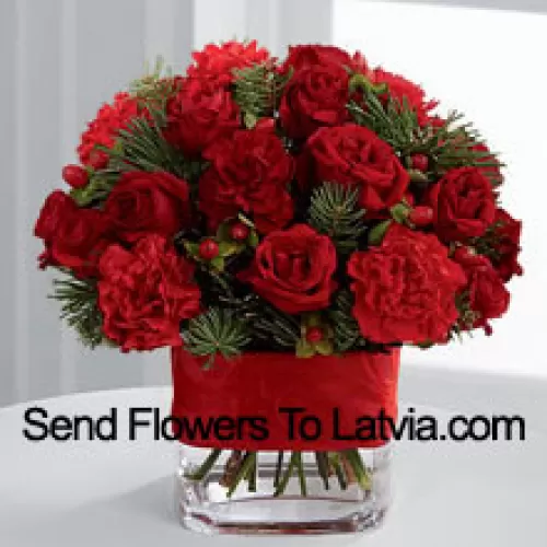 This Bouquet is a cheerful expression of all the merry moments this holiday season has to offer. Bright red spray roses, red mini carnations, burgundy mini carnations, red hypericum berries and assorted holiday greens are elegantly arranged in a clear glass vase bedecked with a rich red ribbon to create a holiday greeting in the spirit of this wondrous season of giving and gratitude. (Please Note That We Reserve The Right To Substitute Any Product With A Suitable Product Of Equal Value In Case Of Non-Availability Of A Certain Product)